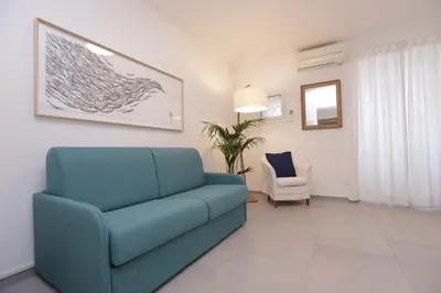 Area soggiorno di Adamaina - Sea view apartment with private garage