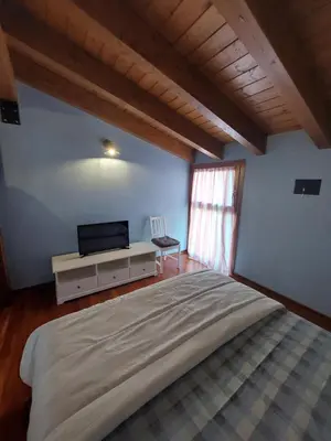Letto o letti in una camera di Les Maisons des Fleurs