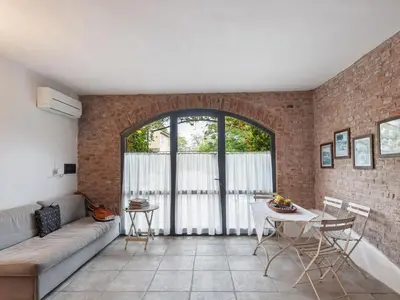Area soggiorno di Stagno Lombardo Garden Flat