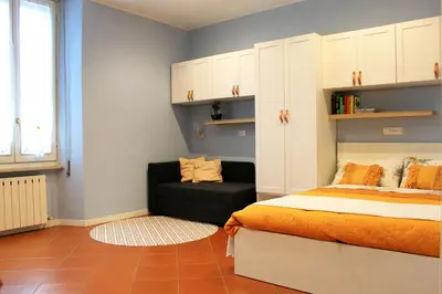 Letto o letti in una camera di Appartamento Zanén, vicino a Cremona fiere e centro storico