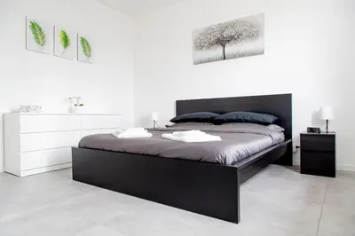 Letto o letti in una camera di Tre Re - Spazioso appartamento con parcheggio