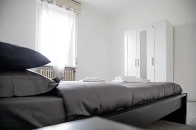 Letto o letti in una camera di Tre Re - Spazioso appartamento con parcheggio