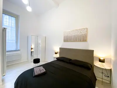 Letto o letti in una camera di Pavia - Esclusivo appartamento in pieno centro