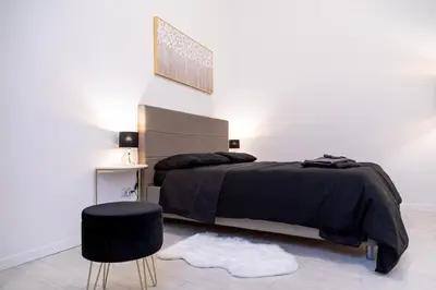 Letto o letti in una camera di Pavia - Esclusivo appartamento in pieno centro