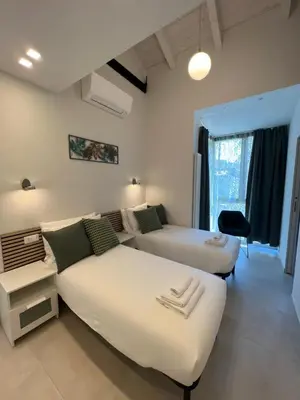 Letto o letti in una camera di Tropicale