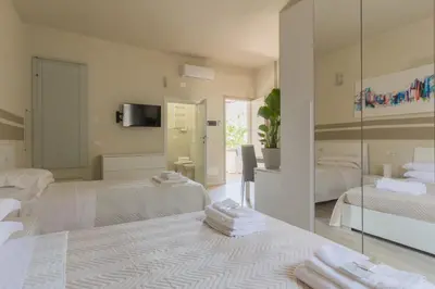 Letto o letti in una camera di Center Rooms