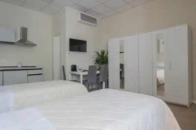 Letto o letti in una camera di Center Rooms