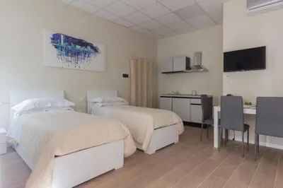 Letto o letti in una camera di Center Rooms