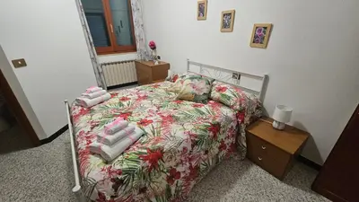 Letto o letti in una camera di La valle fiorita