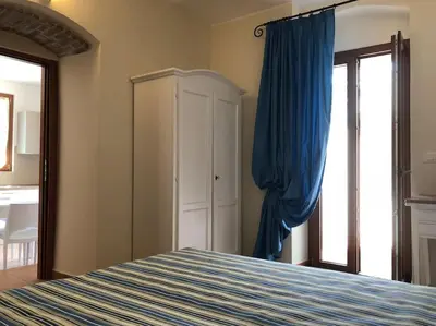 Letto o letti in una camera di Eremo dei Poeti Albergo diffuso