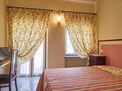 Letto o letti in una camera di Eremo dei Poeti Albergo diffuso