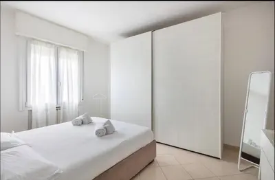 Letto o letti in una camera di Formigine - [Motor Valley-Homes]