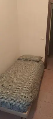Letto o letti in una camera di CASA DELLA NONNA