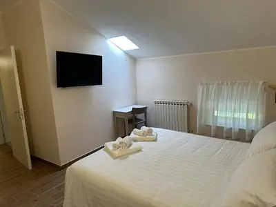 Letto o letti in una camera di Hotel Il Duca barbablu