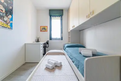 Letto o letti in una camera di GuestHost - Parma Residential Flat with balconyParma Residential Apartment con balcone
