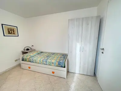 Letto o letti in una camera di Casa Eleonora