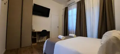 Letto o letti in una camera di R & A Minerva Suites