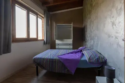 Letto o letti in una camera di Angolo Nascosto Apartments