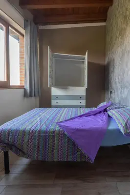 Letto o letti in una camera di Angolo Nascosto Apartments