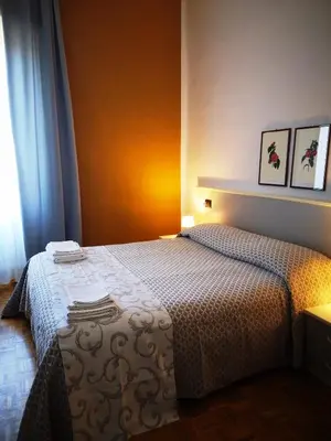 Letto o letti in una camera di ALBERGO BALDAZZI 1916