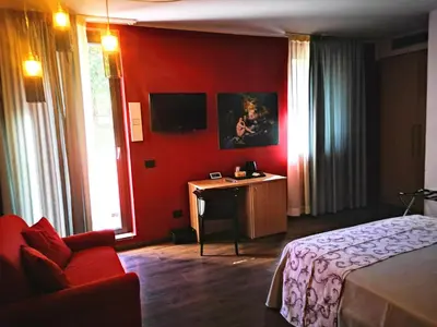 Letto o letti in una camera di ALBERGO BALDAZZI 1916