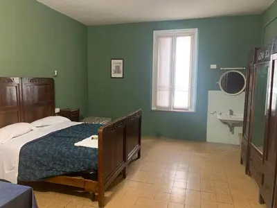 Letto o letti in una camera di Leon doro