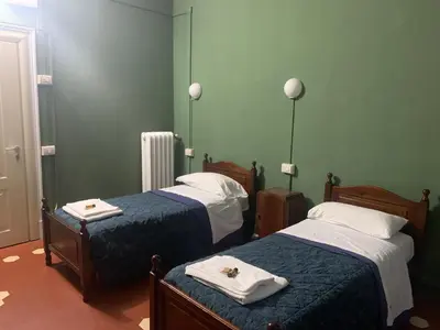 Letto o letti in una camera di Leon doro