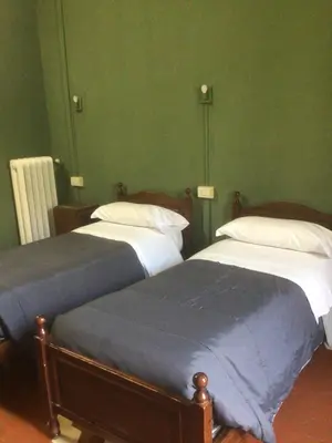 Letto o letti in una camera di Leon doro